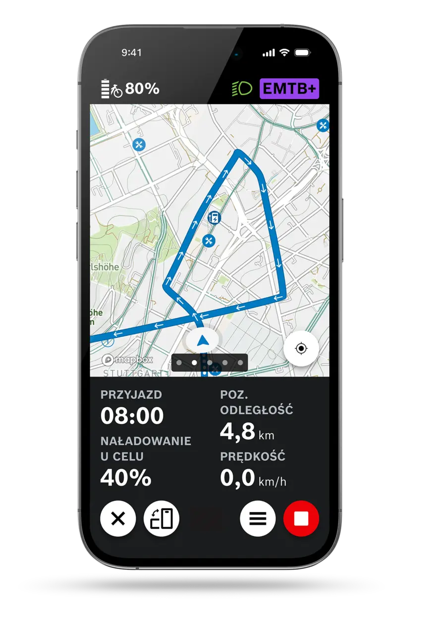 Zrzut ekranu smartfona pokazujący aktywną nawigację po trasie w aplikacja eBike Flow, z mapą, czasem przyjazdu, pozostałym dystansem, poziom naładowania po przyjeździe i aktualną prędkość.