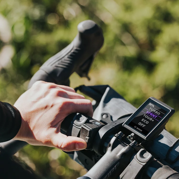 Close-up of a bicycle handlebar with Kiox display set in Sprint mode.