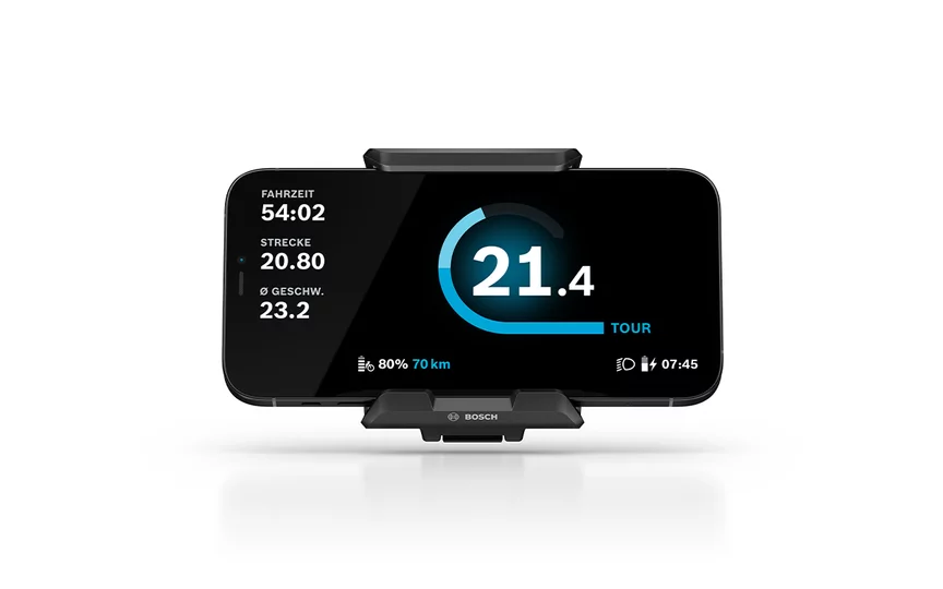Freigestellte Darstellung des SmartphoneGrip mit Smartphone im Tour Modus auf hellgrauem Hintergrund.